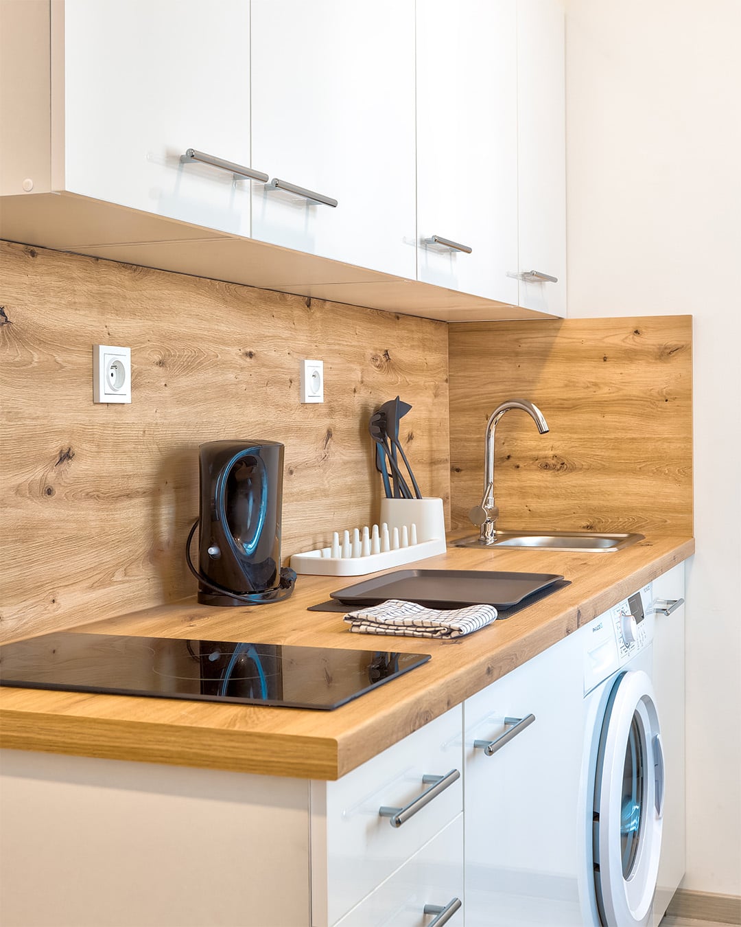 Apartment kitchenette with modern appliances